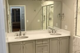 Two Sink With A Big Mirror